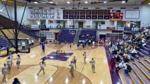 Carroll and Monroe Central warmup at Bill Green Athletic Arena in Marion, Ind.