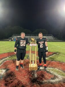 Gaige Kuzmicz and Jaxin Wells with the Corn Bowl Trophy